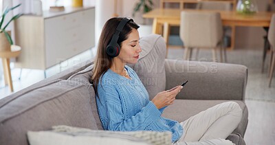 Buy stock photo Woman, relax and phone with headphones on sofa for online, streaming or listening to audio at home. Calm, sound and female person with tech in living room for mindfulness, podcast or peace on weekend