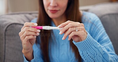 Buy stock photo Pregnancy test, results and hands of woman on sofa for fertility treatment, ivf and family planning. Home, pregnant and person with medical stick for news, maternity or health on couch in living room