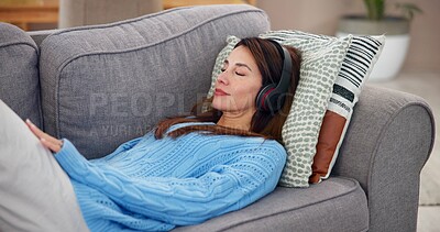 Buy stock photo Woman, relax and sleeping with headphones on sofa for online, subscription and listening to sound. Calm, audio and person with tech in living room for mindfulness, podcast or peace at home on weekend