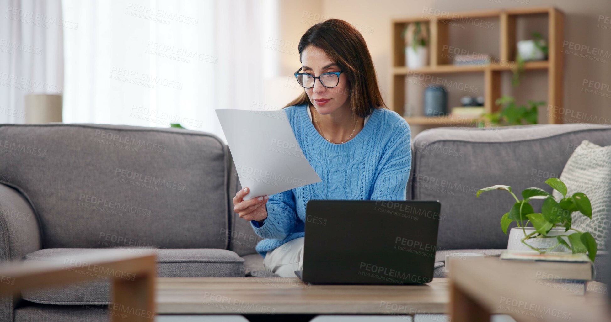 Buy stock photo Documents, reading and woman on laptop in home with paperwork for online banking, finance and taxes. Remote work, bookkeeping or female person with report for debt payment, financial review and bills