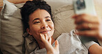 Woman, waving and phone for video call in home, communication and online for talking in bedroom. Female person, internet connection and virtual conference in bed, comfortable and app for conversation