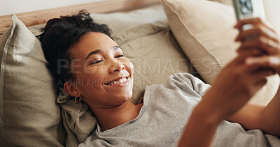 Buy stock photo Woman, rest and phone on bed for social media surfing in home, typing message and notification. Female person, bedroom and online for morning communication, reading ebook and weekend in apartment