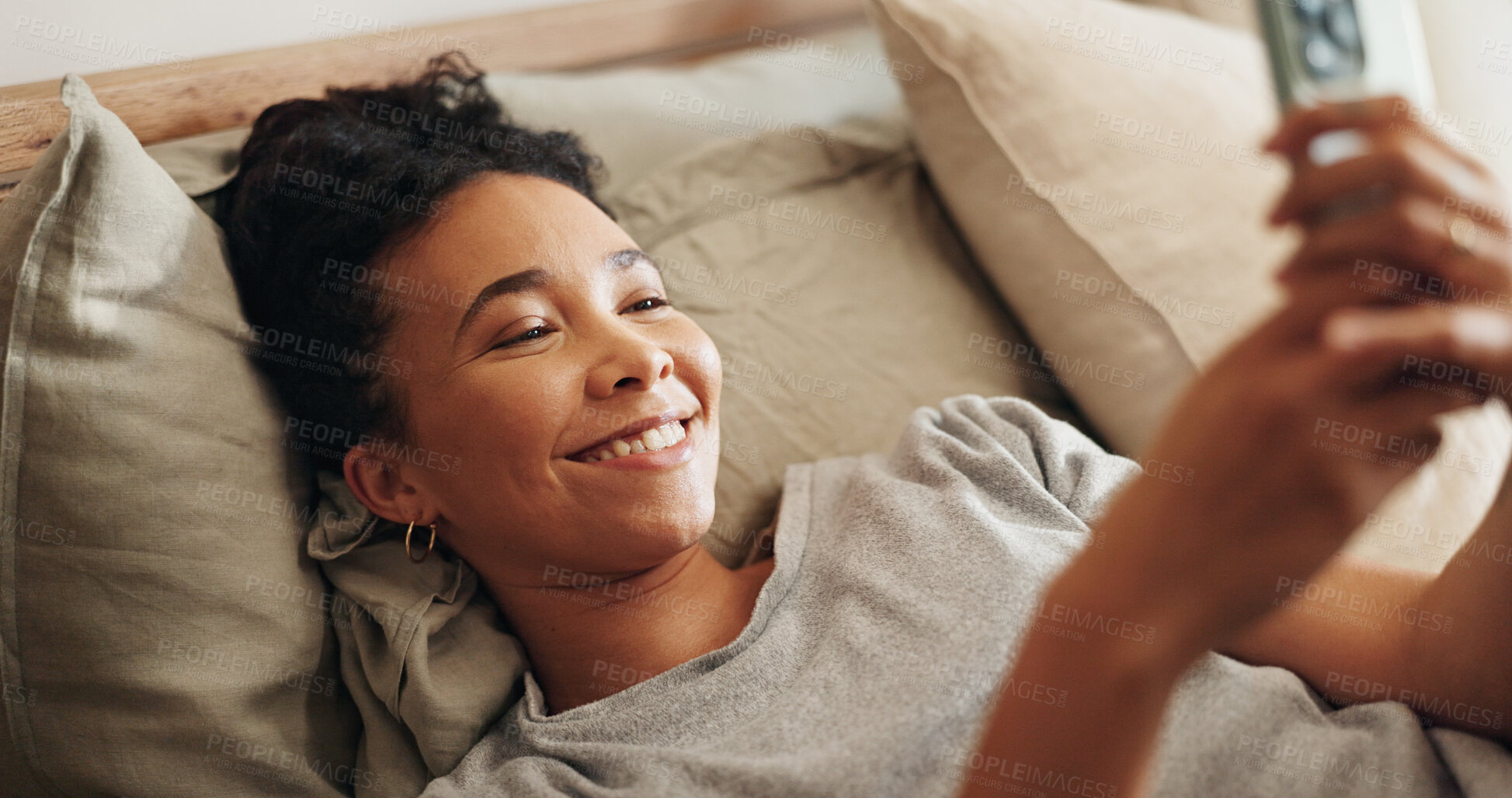 Buy stock photo Woman, rest and phone on bed for social media surfing in home, typing message and notification. Female person, bedroom and online for morning communication, reading ebook and weekend in apartment