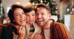 Family, smile and portrait in home for Christmas, celebration and bonding together with holiday and hug. Parents, boy and happy people in living room for memory, connection and vacation with embrace