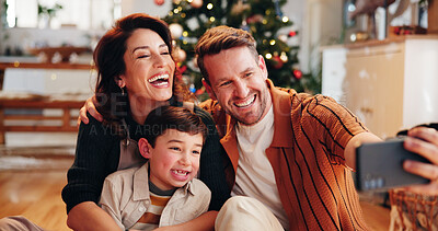 Buy stock photo Family, smile and selfie in home for Christmas, celebration and social media with holiday and hug. Parents, boy and happy people in living room for memory, profile picture and vacation with embrace