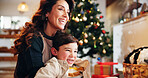 Mother, smile and bonding in home for Christmas, celebration and love together with holiday and hug. Mom, son and happy people in living room for relax, connection and vacation with family embrace