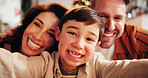 Family, relax and selfie in home for Christmas, celebration and social media with holiday and hug. Parents, boy and happy people in living room for memory, profile picture and vacation with embrace