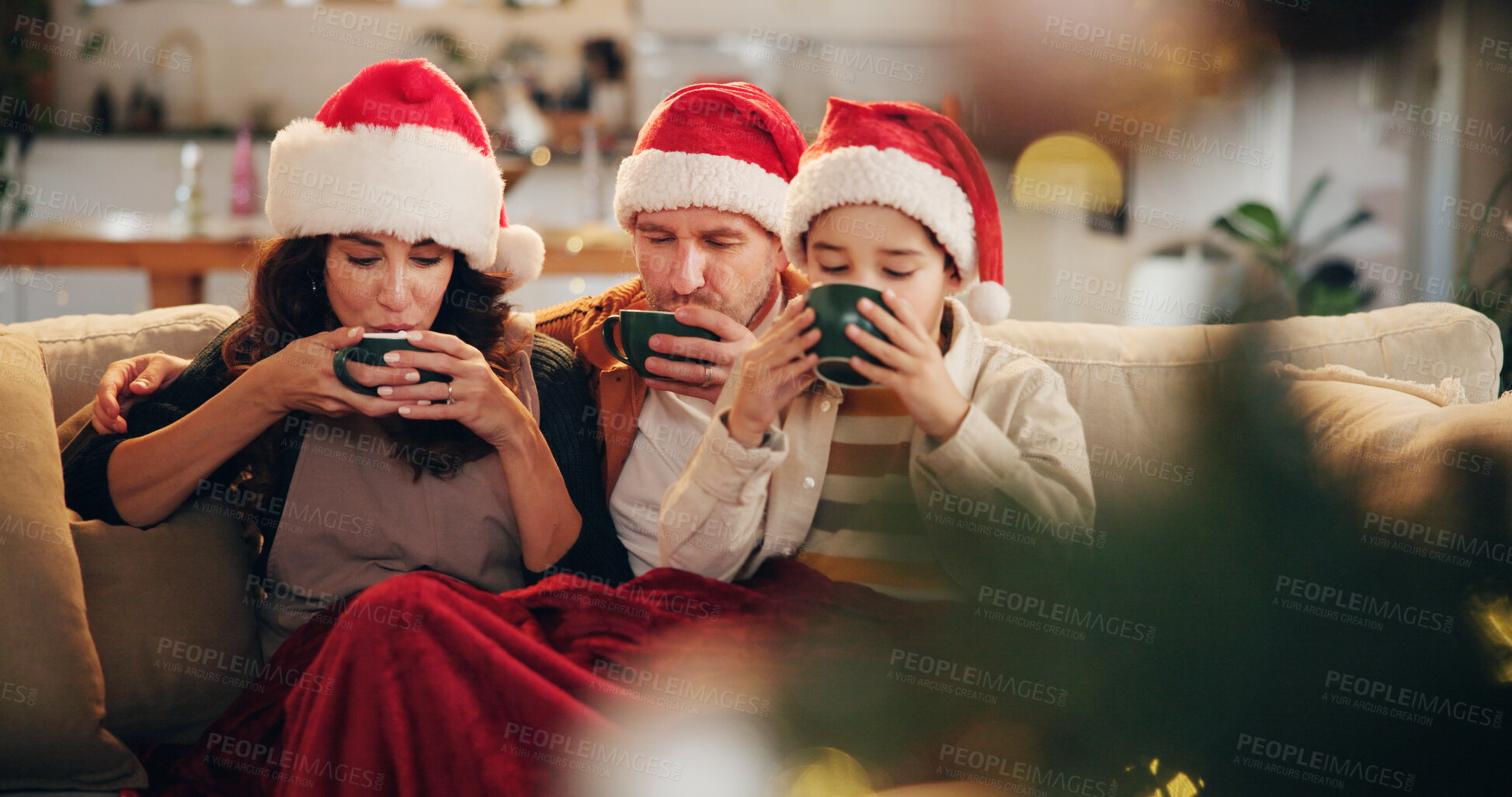 Buy stock photo Christmas, family or drinking hot chocolate on sofa with peace, coco or relax in home. Parents, kid or eggnog in living room for comfort, warmth or enjoy festive season in winter with love or support