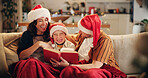 Christmas, family and laugh on sofa with book, funny storytelling and joking together. Parents, child and happy in home with novel, reading humor and excited at festive season with comedy on couch