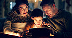 Tablet, relax and child with parents in home watching movie, film or show online for entertainment. Happy, light and kid on sofa with mother and father streaming video on digital technology at night.