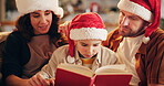 Christmas, family and book on sofa for reading, learning and traditional literature for religious education. Parents, child and Bible in home for storytelling, Christianity and comfort in living room