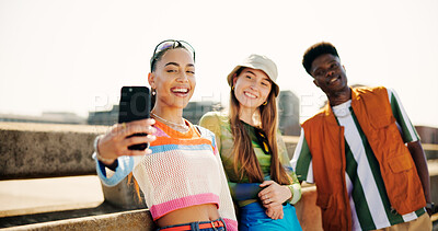 Buy stock photo City, group and friends with smile for selfie, summer memory and profile picture for social media. Bridge, women and man with photography for gen z fashion, bonding together and connection outdoor