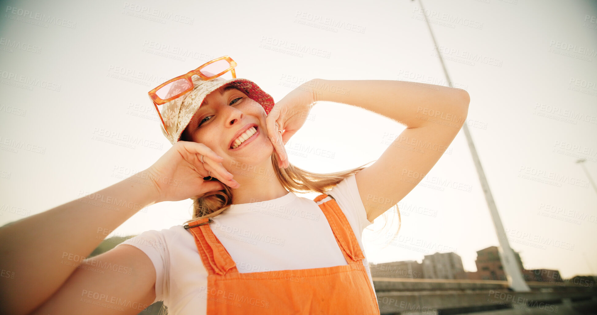 Buy stock photo Women, happy and fashion in city, summer and confidence with sunglasses, hat and outdoor on metro bridge. Girl, person and smile on road, sidewalk and sunshine in town with streetwear in Germany