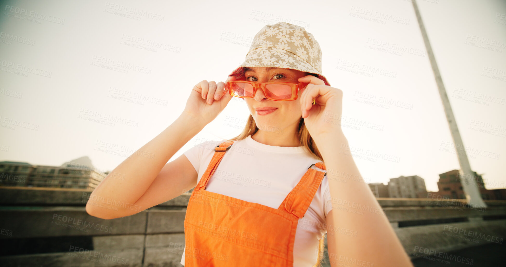 Buy stock photo Bridge, woman and portrait with sunglasses for fashion, streetwear and confidence for cool clothes with pride. Urban, female person and smile with positivity for hipster, trendy hat and gen z in city