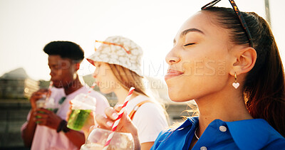 Buy stock photo Smoothie, friends and gen z woman in city with smile, beverage and cocktail of green juice. Face, outdoor or girl in urban town drinking liquid with straw for health nutrition or plant based diet