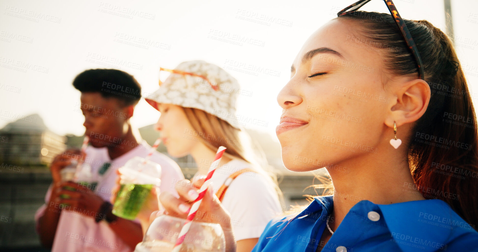 Buy stock photo Smoothie, friends and gen z woman in city with smile, beverage and cocktail of green juice. Face, outdoor or girl in urban town drinking liquid with straw for health nutrition or plant based diet