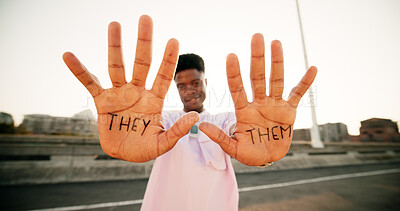 Buy stock photo Hands, they and them with sign, person and gender identity with voice, opinion and portrait on metro bridge. African student, happy and open palm with writing, protest and lgbtq inclusion in Kenya