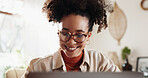 Laptop, smile and woman at desk in home office with online report, schedule or email. Computer, remote work and happy consultant reading business plan, news or website for freelance project research