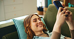 Smile, girl and rest with phone on couch for communication, social media and notification update. Happy, woman and relax with mobile for reading message, online chat and entertainment game at house