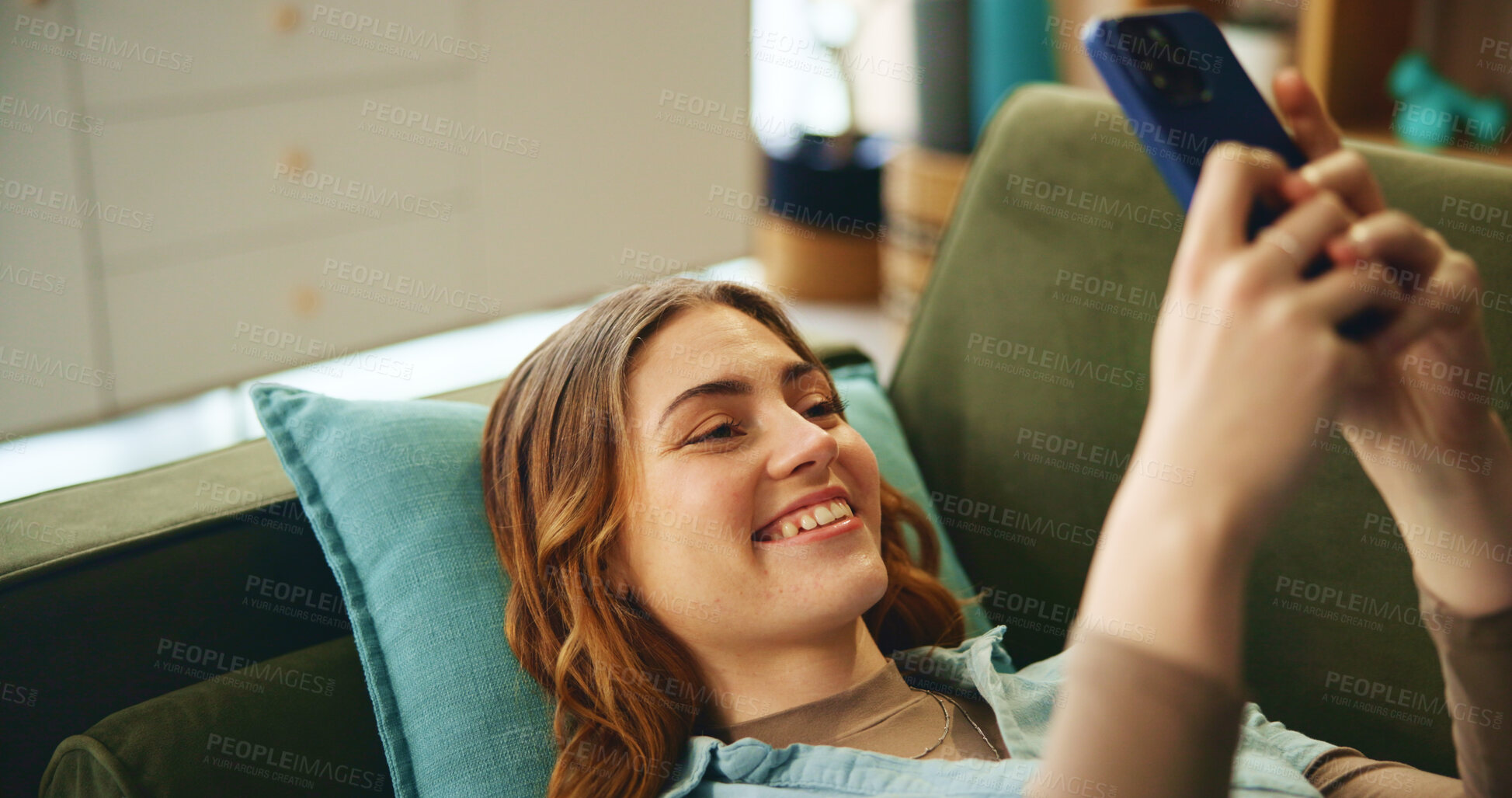 Buy stock photo Smile, girl and rest with phone on couch for communication, social media and notification update. Happy, woman and relax with mobile for reading message, online chat and entertainment game at house