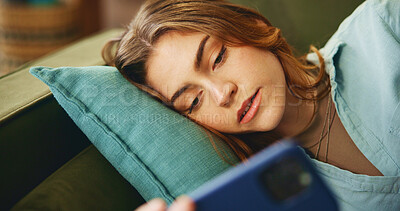 Buy stock photo Tired, woman and relax with phone on couch for communication, social media or reading notification. Bored, girl and mobile with message error, online chat or fatigue for game fail of mistake at house