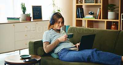 Buy stock photo Laptop, headphones and girl on sofa with coffee, comfort or listening to online webinar in home. Elearning, relax and student on couch with computer, podcast connection or music streaming in lounge