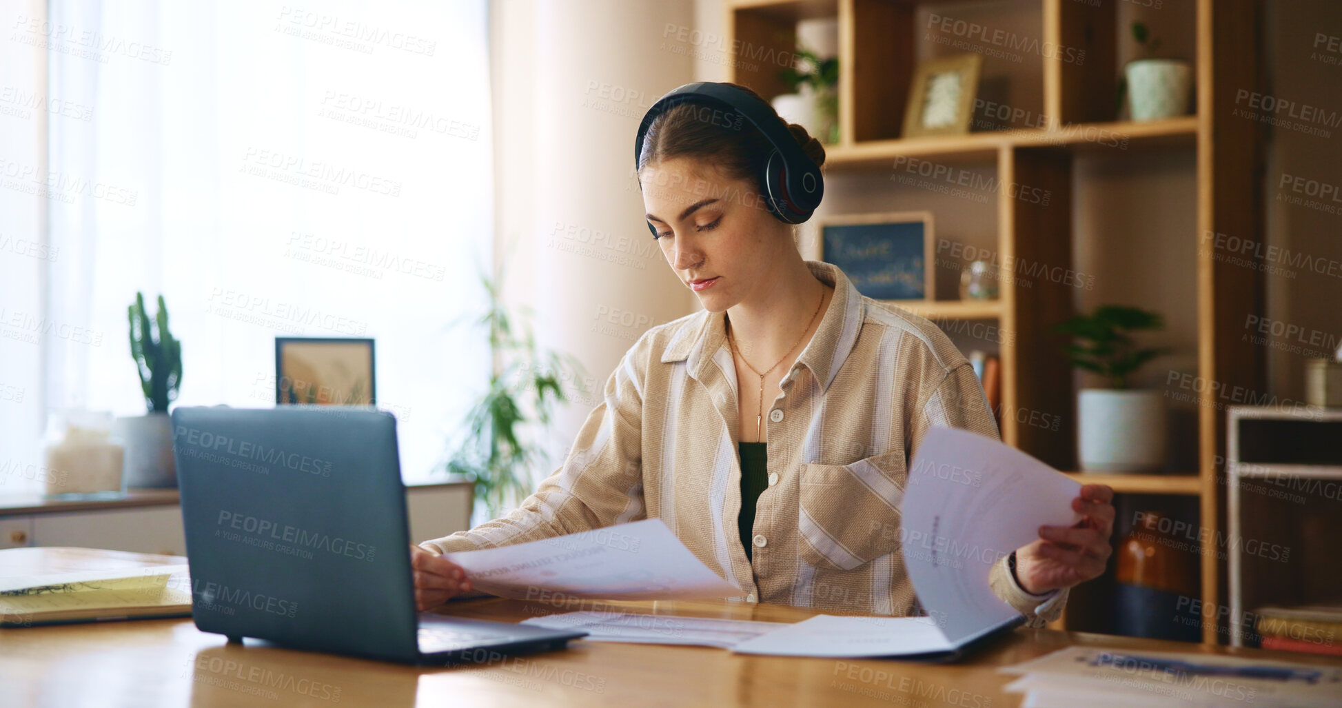 Buy stock photo Remote work from home, documents and woman with headphones, listening to music and laptop. Person, freelancer and entrepreneur with pc, headset and online reading for project, paperwork or connection