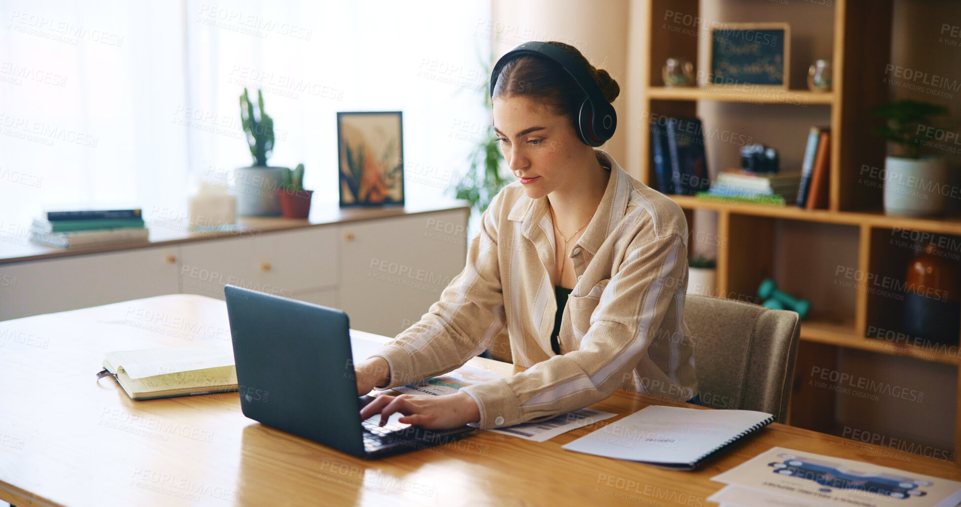 Buy stock photo Remote work from home, laptop and woman with headphones, listening to music and typing. Person, freelancer and entrepreneur with pc, headset and online reading for project, research and connection