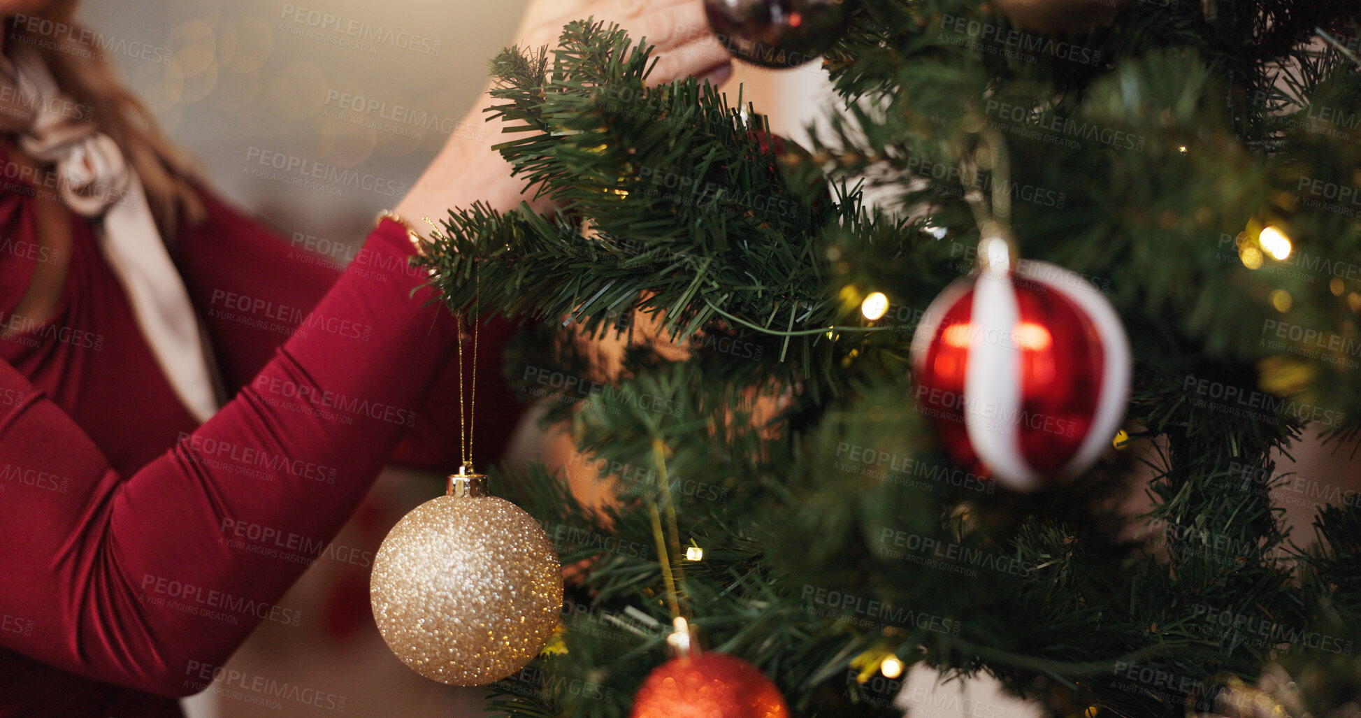 Buy stock photo Christmas, hand and tree with person and decoration for bauble, gift giving and festive season. Xmas, holiday and celebration with closeup in living room at home for tradition, noel and winter
