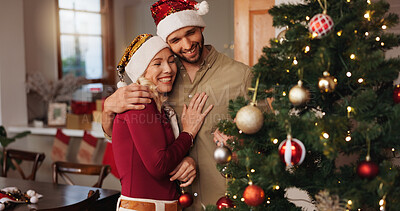 Buy stock photo Christmas, hug and tree with couple in living room for decoration, gift giving and festive season. Xmas, holiday and celebration with man and woman at home for tradition, noel vacation and love