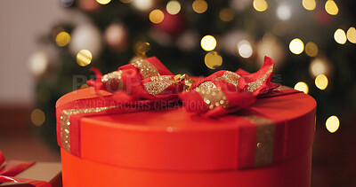 Buy stock photo Box, Christmas and present in living room, festive and season for giving, sparkle and decoration for event. House, celebration and creative with ribbon, red color and tradition for holiday and party