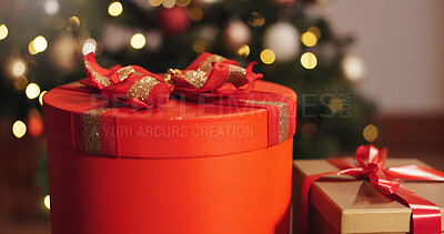Buy stock photo Box, Christmas and present in living room, sparkle and season for giving, festive and decoration for event. House, celebration and creative with ribbon, red color and tradition for holiday and party