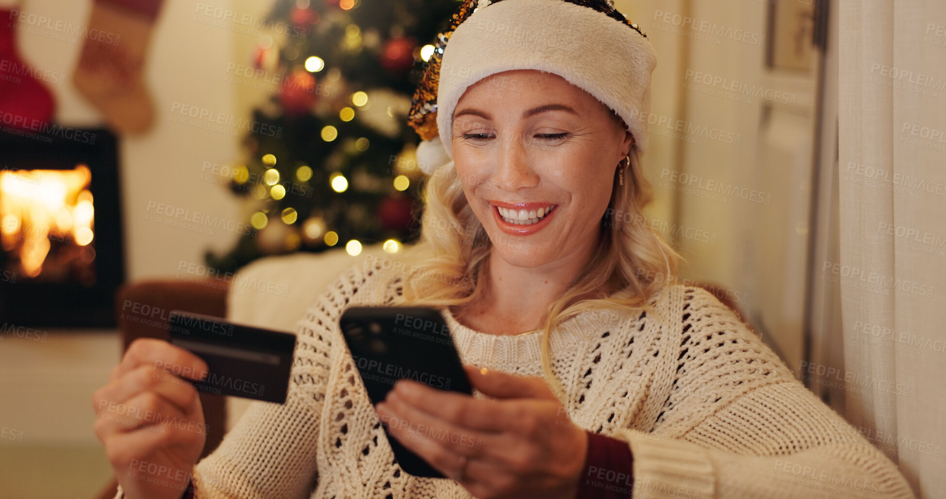 Buy stock photo Woman, happy and smartphone with credit card for Christmas shopping, sale and discount. Female person, apartment and smile or excited on internet or website for buying gifts, presents and payment