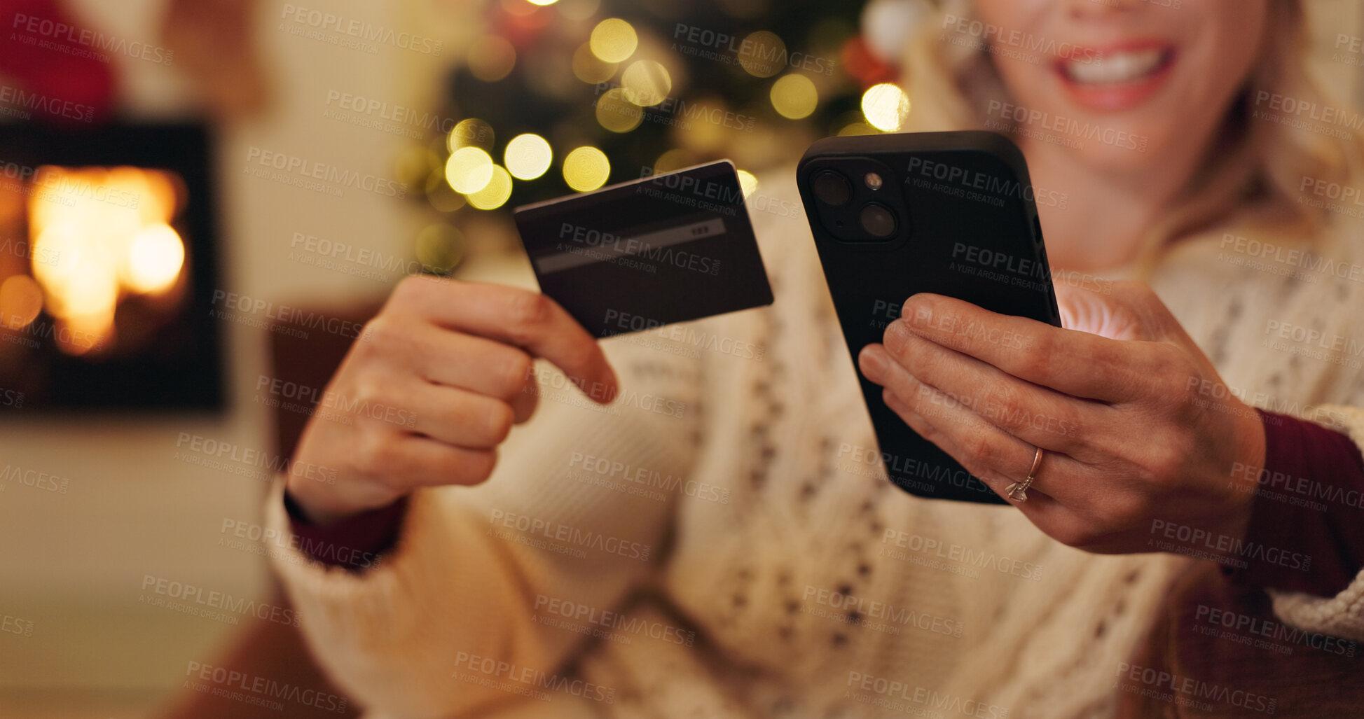 Buy stock photo Woman, hands and smartphone with credit card for Christmas shopping, sale and discount. Female person, apartment and smile or happy on internet or website for buying gifts, presents and payment