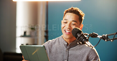 Buy stock photo Radio presenter, man and happy with tablet on microphone for live streaming, talk show and online discussion. Male person, content creator and smile as podcast host in studio social media engagement