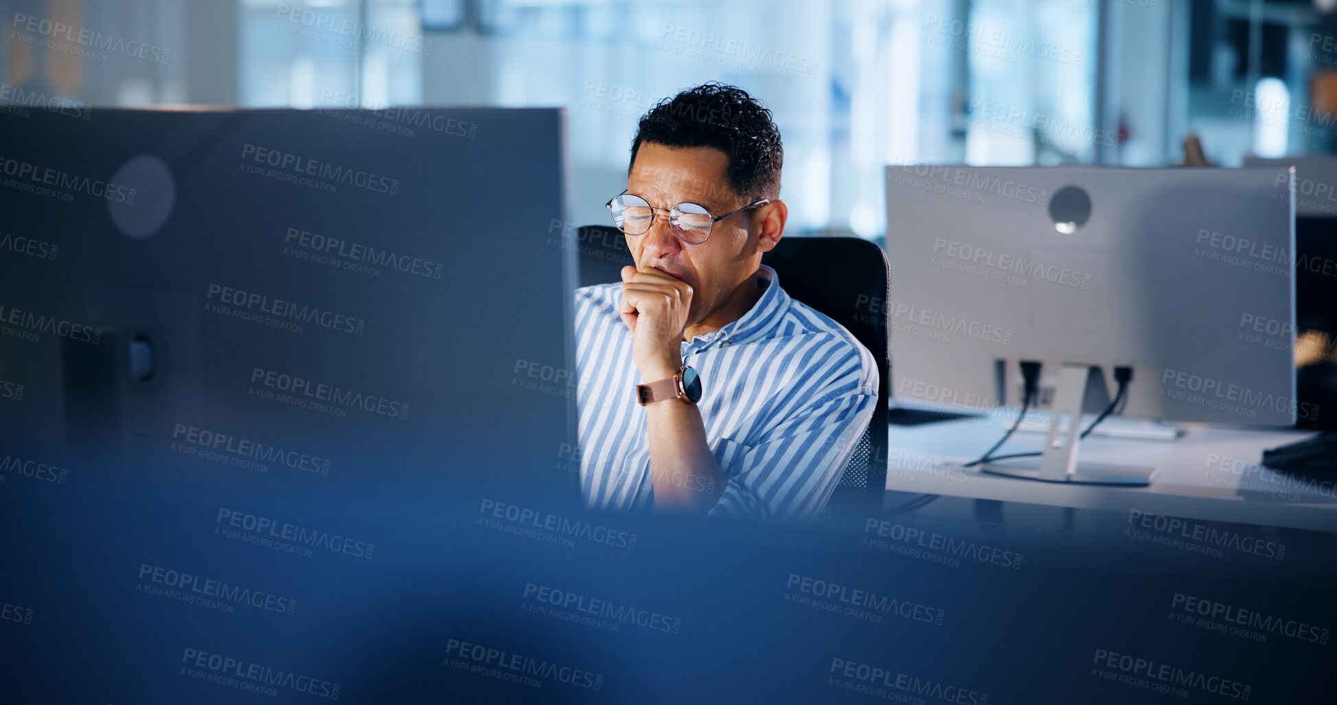 Buy stock photo Tired, night and yawning with business man and computer for deadline report, overtime and advisory. Research, fatigue and reading with person in office for investment portfolio, burnout and email