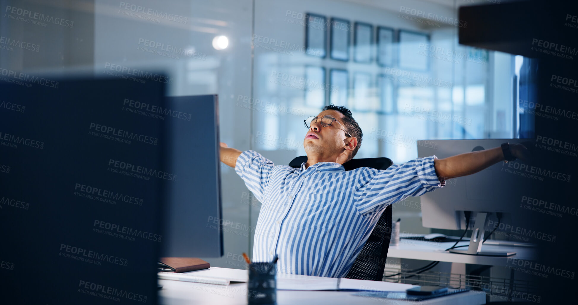 Buy stock photo Man, stretching and tired at night in office with fatigue, computer and deadline at media company. Exhausted person, writer or editor with burnout, stress and done with project at creative agency