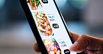 Hand, phone screen and menu for food delivery on app with choice for salad, diet and dinner with ecommerce. Person, smartphone and ui with click, search and decision for order with overtime at agency