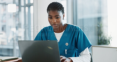 Buy stock photo Hospital, nurse and black woman with laptop, typing and thinking with research, online reading and internet. African person, medical or professional with computer, doctor and digital app with email