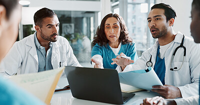 Buy stock photo Medical, team and laptop with discussion in hospital for healthcare treatment innovation or IRB approval report. Diversity, nurse or doctor staff in clinic boardroom with documents for patient record