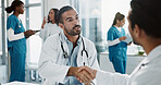 Meeting, handshake and doctors in office at hospital for planning medical diagnosis or treatment. Discussion, interview and healthcare worker shaking hands with board director at clinic for feedback.