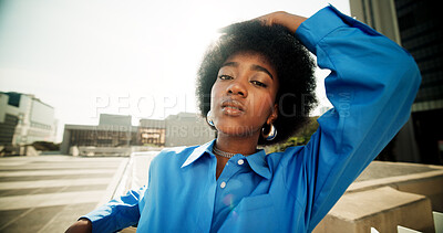 Buy stock photo Portrait, fashion and black woman in city, edgy and travel with buildings, urban town or attitude. African person, gen z or girl in street, pride or confidence with stunning outfit or stylish clothes