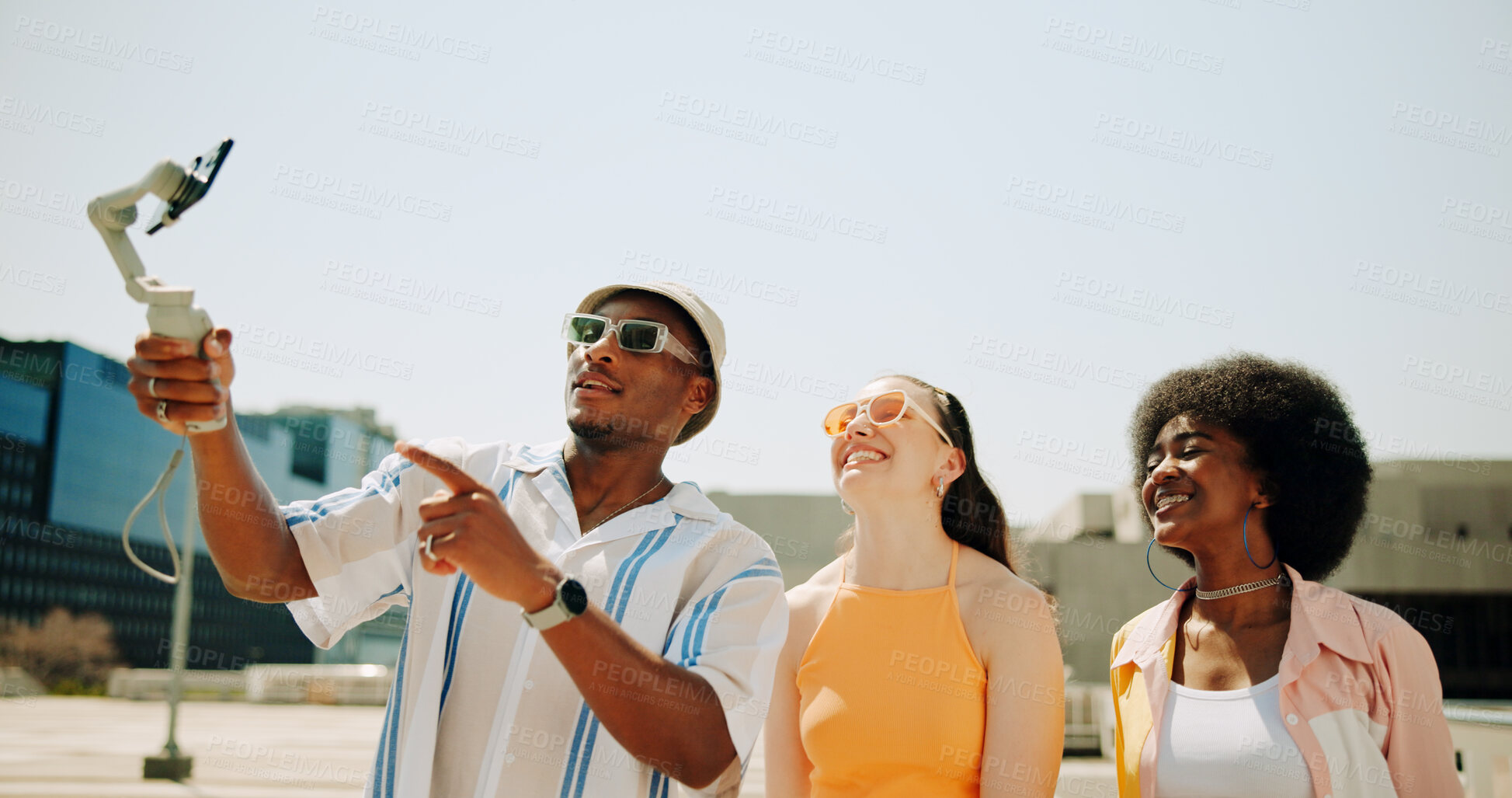 Buy stock photo People, selfie stick and influencer for fashion outdoor with social media post, live streaming and filming podcast. Friends, content creator and streetwear for broadcast, online subscription and roof