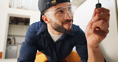 Buy stock photo Plumber, man and tools for pipe in kitchen with home maintenance and fixing leak by sink with glasses. Plumbing contractor, handyman and screwdriver for filter system installation for small business