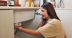 Woman, phone call or stress in kitchen for plumbing, booking consultation or cloth at sink. Homeowner, anxiety or talk on mobile for maintenance callout, service or emergency repair for leak in home