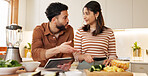 Home, cooking and couple with tablet, conversation and bonding together with website for nutrition. Apartment, man or woman in kitchen, vegetables or tech with internet, ingredients or online recipe