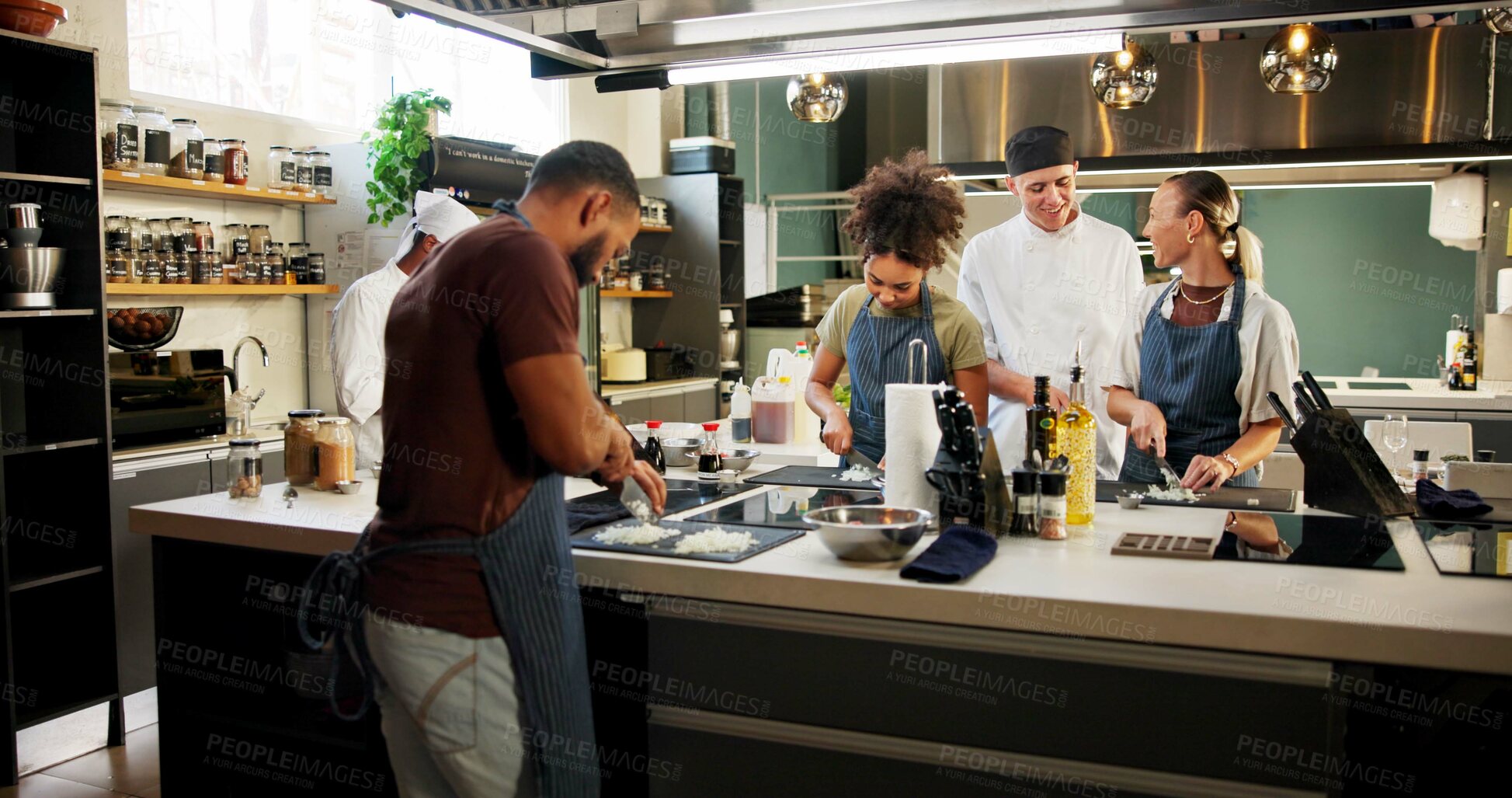 Buy stock photo Cooking course, chef and people learning in kitchen for knife skills, cutting technique and practice. Culinary class, students and mentor with lesson on onion preparation and education in hospitality