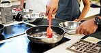 Hands, cooking and stirring in kitchen, chef and group in hospitality, food and planning in restaurant. Menu, fine dining and people with skills, ingredients and service for cuisine and culinary