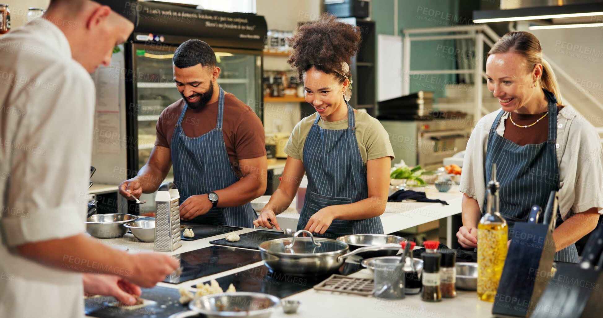 Buy stock photo Cooking, course and chef in kitchen with group for meal preparation, teaching gourmet recipe or learning skills. Culinary class, people and mentor with lesson on food education and cuisine knowledge