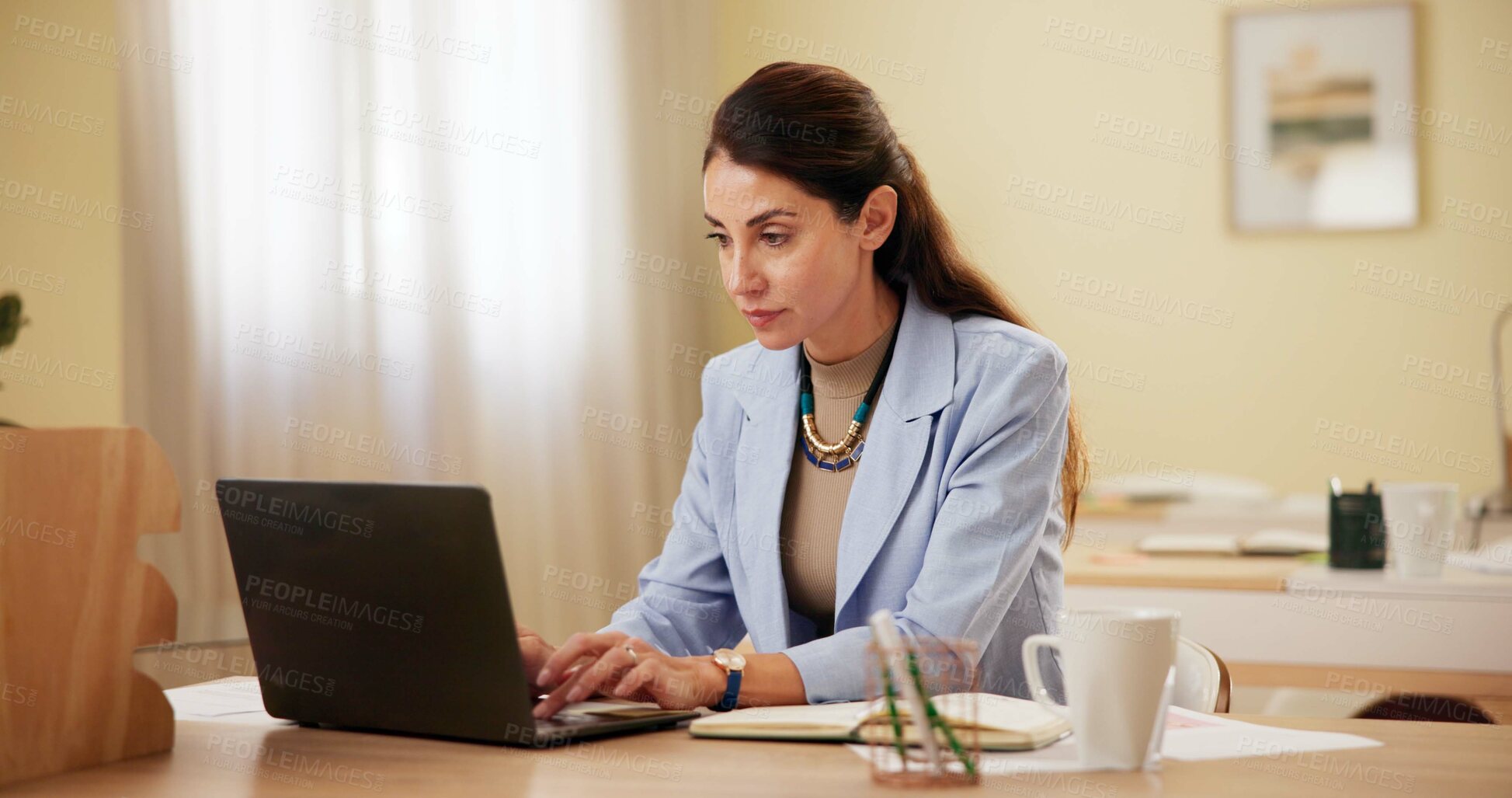 Buy stock photo Laptop, serious and business woman typing in office for  research, creative blog and copywriting. Computer, mature manager and writing email, feedback or review report for content writer at startup